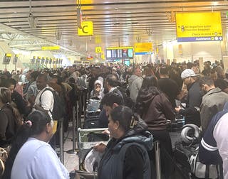 Passengers reported long queues and manual check-ins (KC Barnard/X/@lovebydeception/PA)